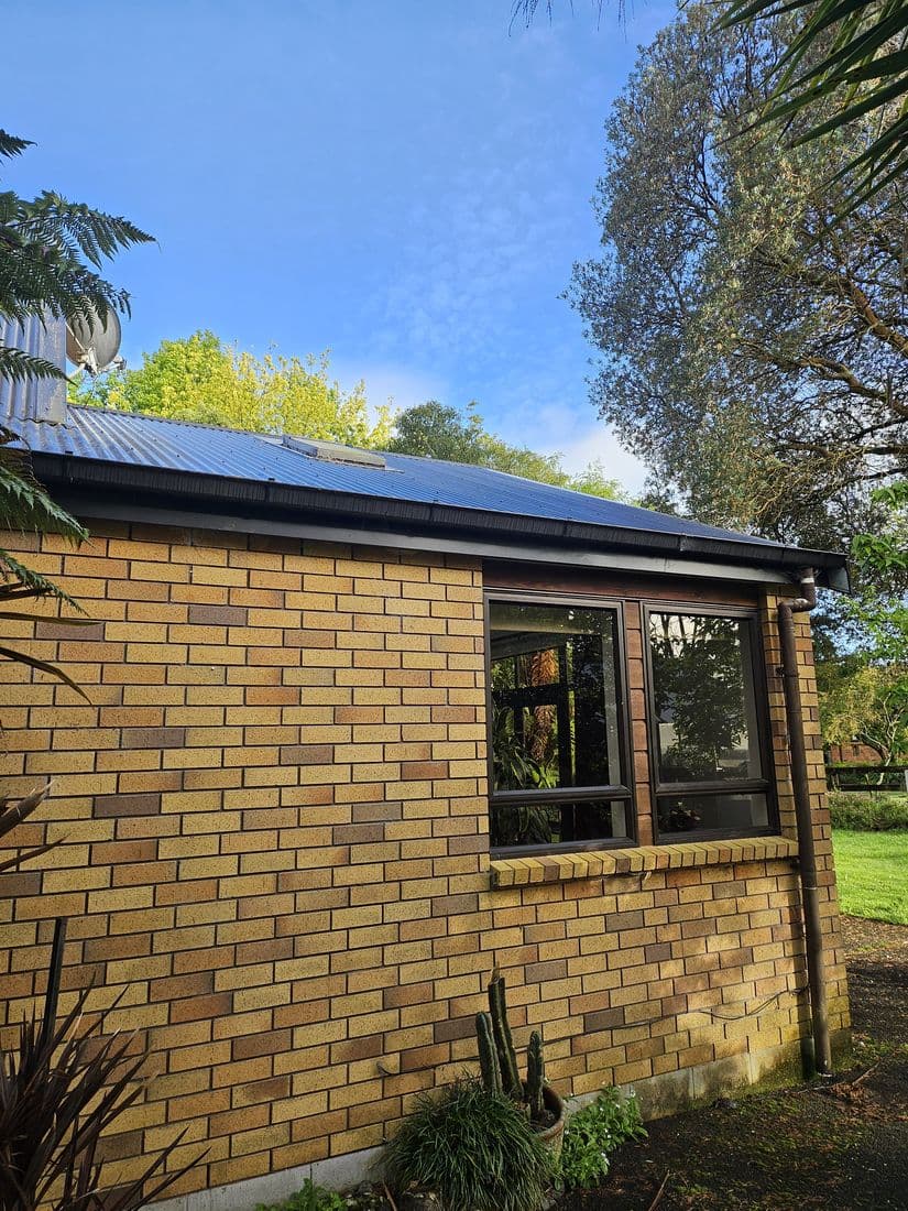 Brick home with a crisp dark roofline